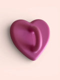 Smooth pink heart-shaped object on soft background