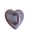 Smooth purple heart-shaped object with glossy finish on light background