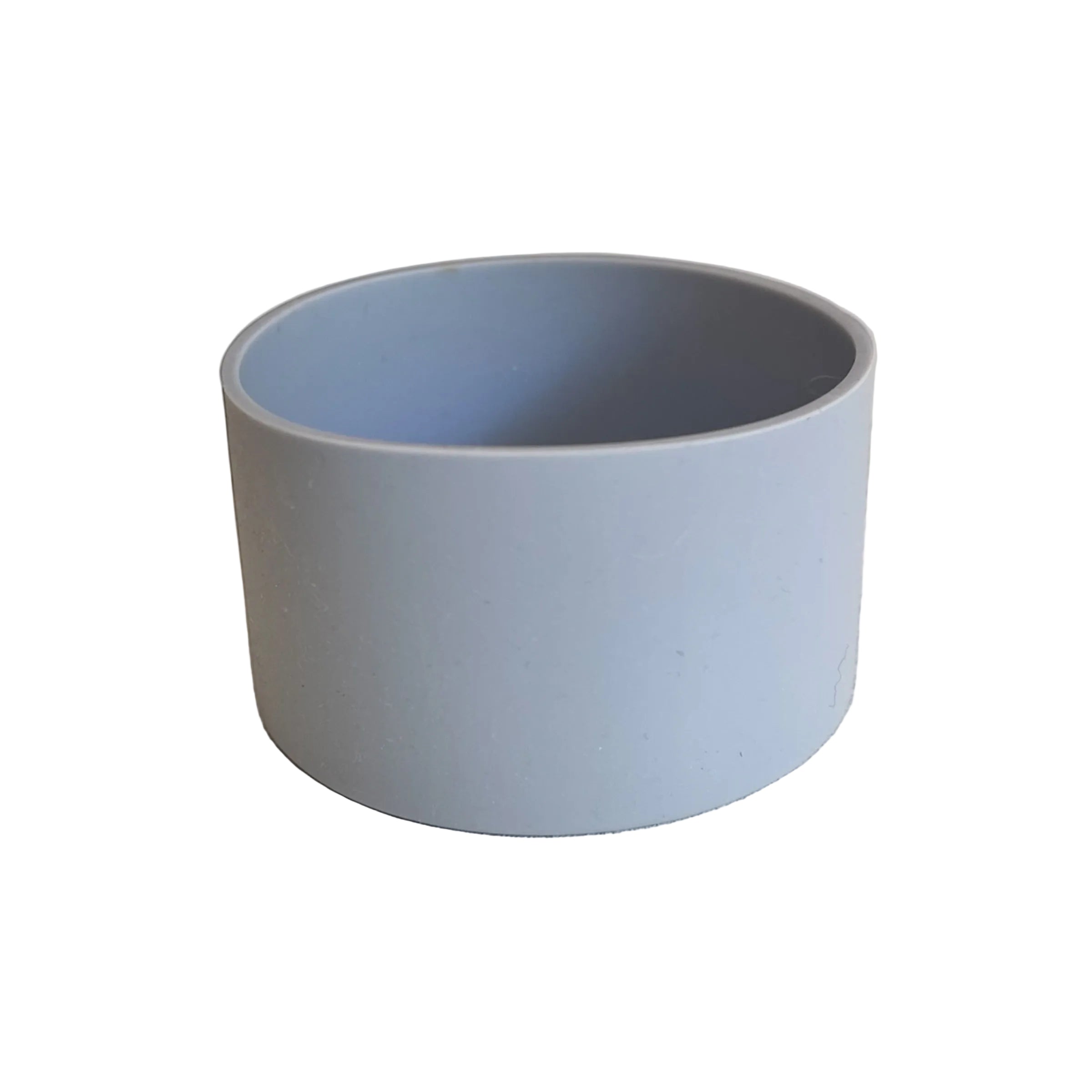 Gray boot on a textured surface with a neutral background