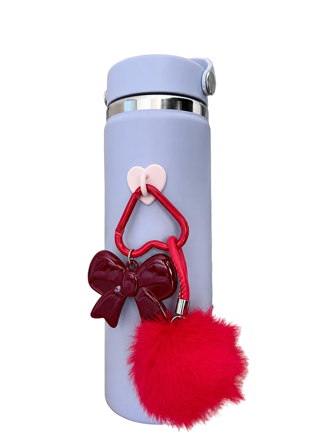 Light blue thermos with red bow and pom-pom charm on a table.