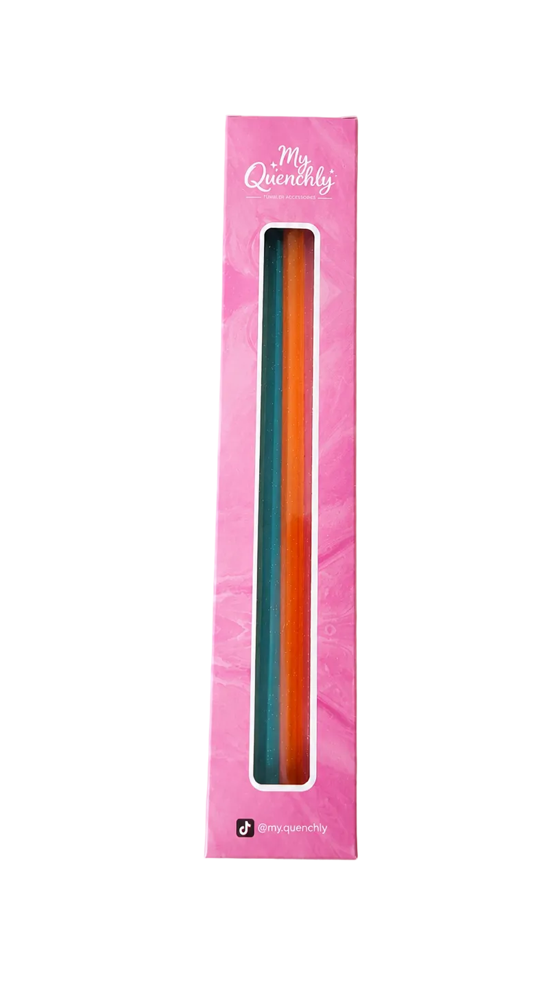 Colorful straws a pink packaging box on a beige background